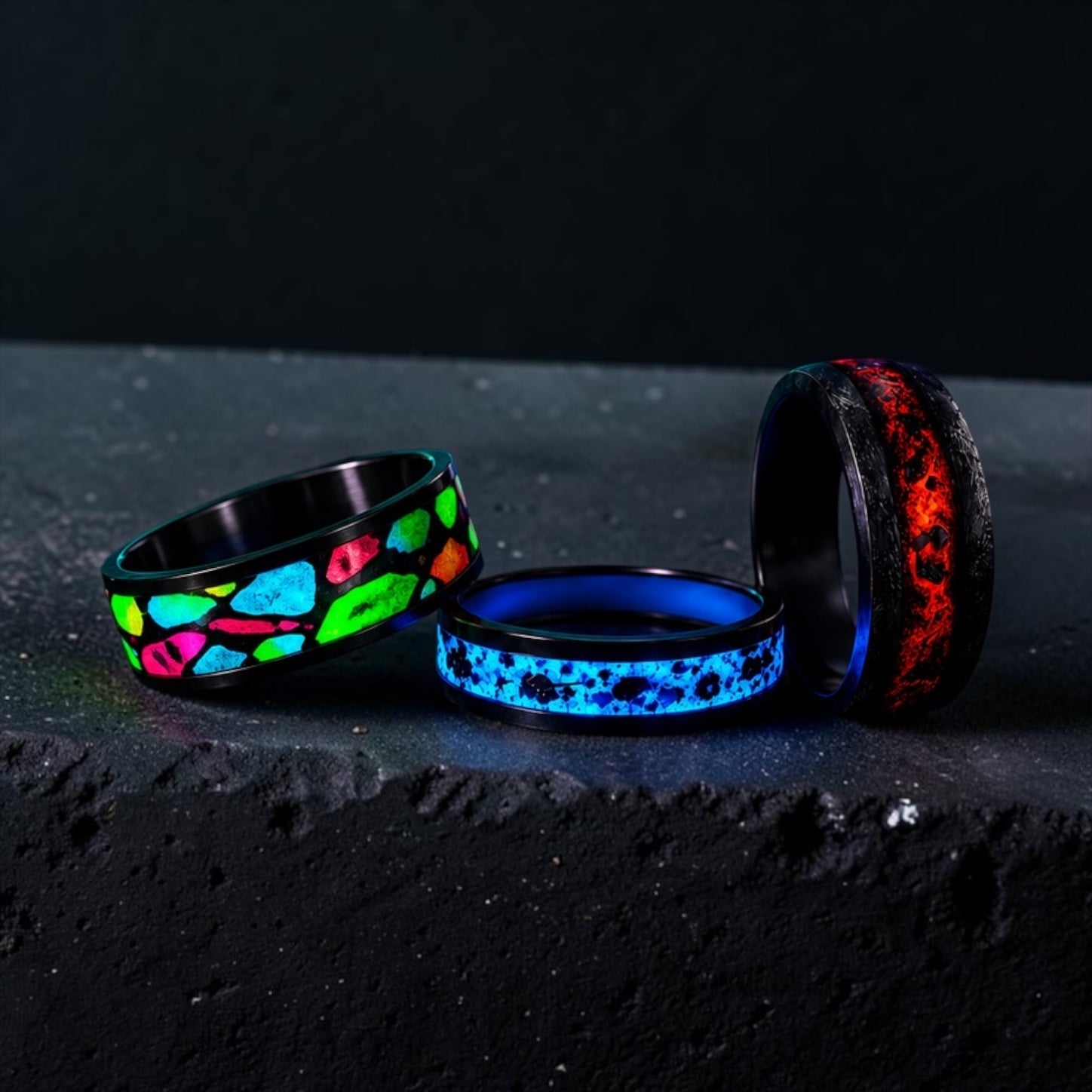 Glow-in-the-dark rings displaying vibrant luminous colors in low-light conditions.
