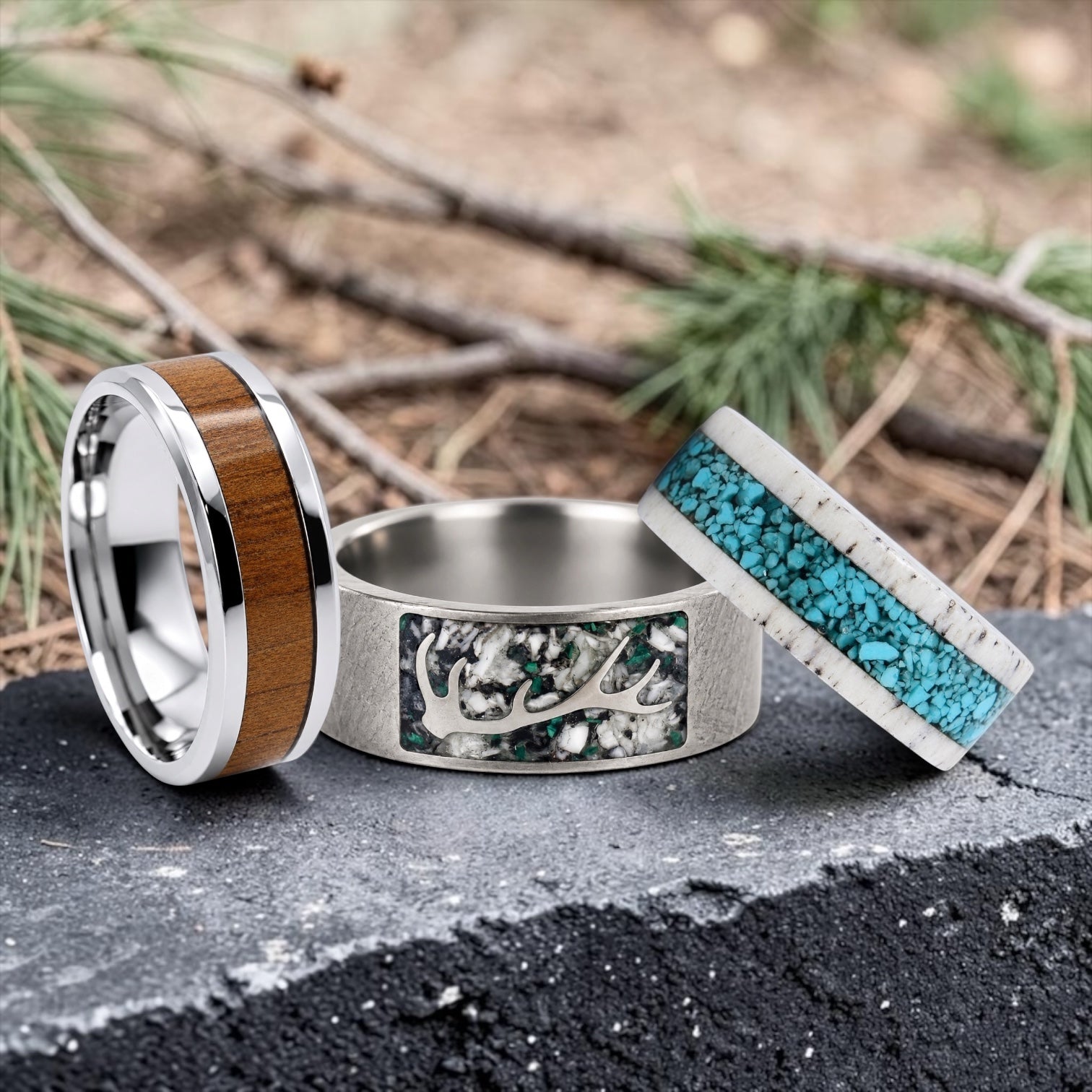 Nature-inspired rings featuring deer antler, wood, elk tooth, and rustic materials.