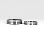 Matching two-tone wedding band set, 6mm his and 4mm hers, with frosted finish top half and satin lower half separated by a precision groove, handcrafted in Utah