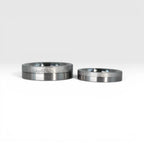 Matching two-tone wedding band set, 6mm his and 4mm hers, with frosted finish top half and satin lower half separated by a precision groove, handcrafted in Utah