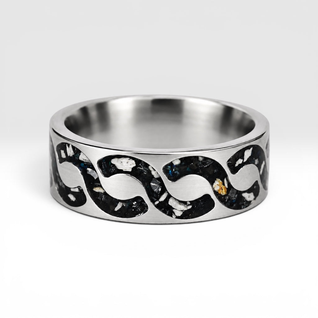 Abyssforge titanium ring featuring Megalodon tooth fragments, Campo del Cielo meteorite shavings, Mount Etna lava stone, green opal accents, and a sculpted flowing pattern.