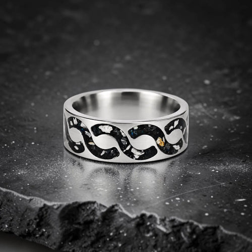 Abyssforge titanium ring featuring Megalodon tooth fragments, Campo del Cielo meteorite shavings, Mount Etna lava stone, green opal accents, and a sculpted flowing pattern.