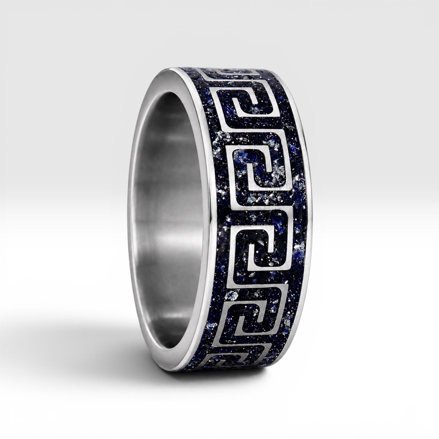 Titanium Greek key ring with blue goldstone and silver leaf inlay, geometric design with deep blue shimmer