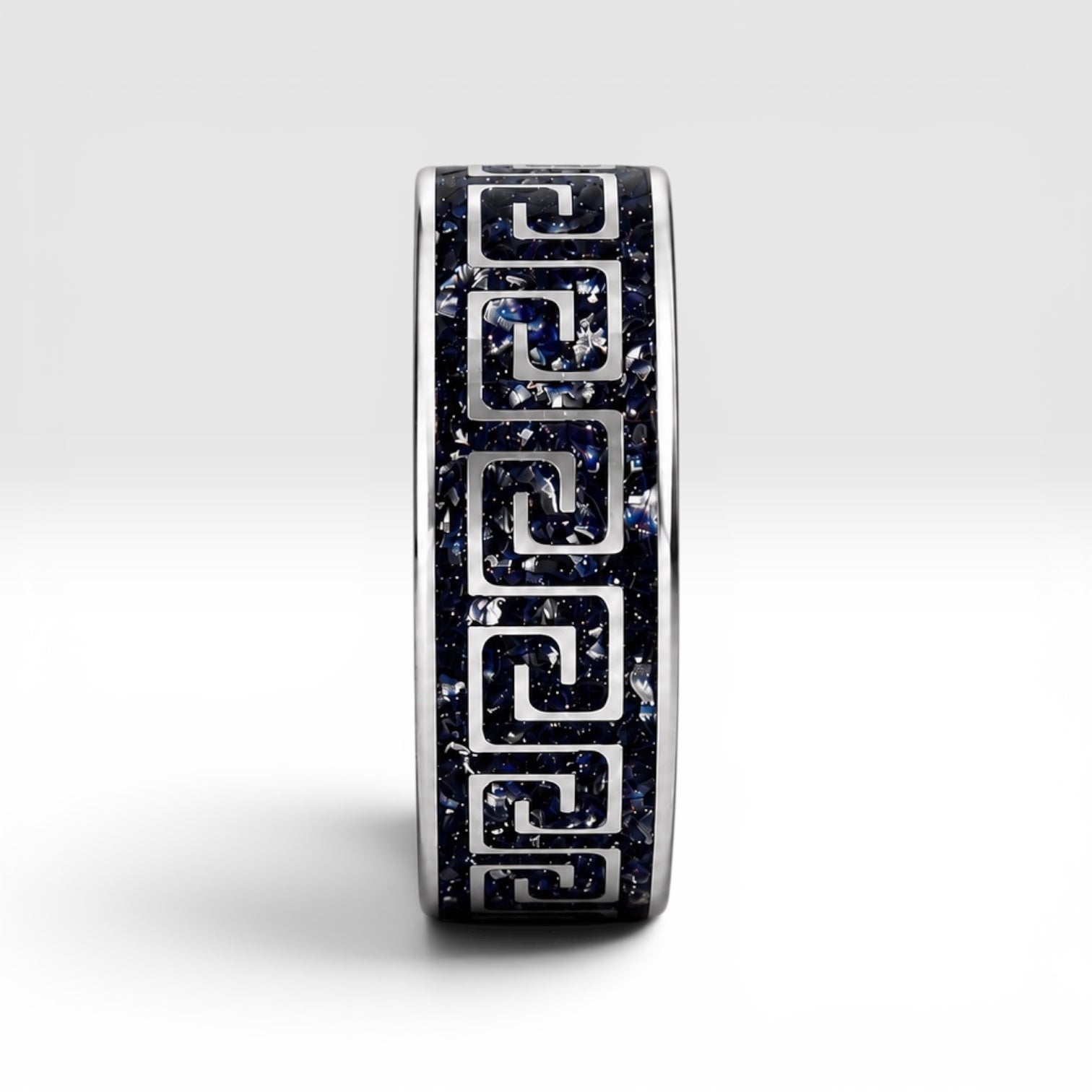 Titanium Greek key ring with blue goldstone and silver leaf inlay, geometric design with deep blue shimmer