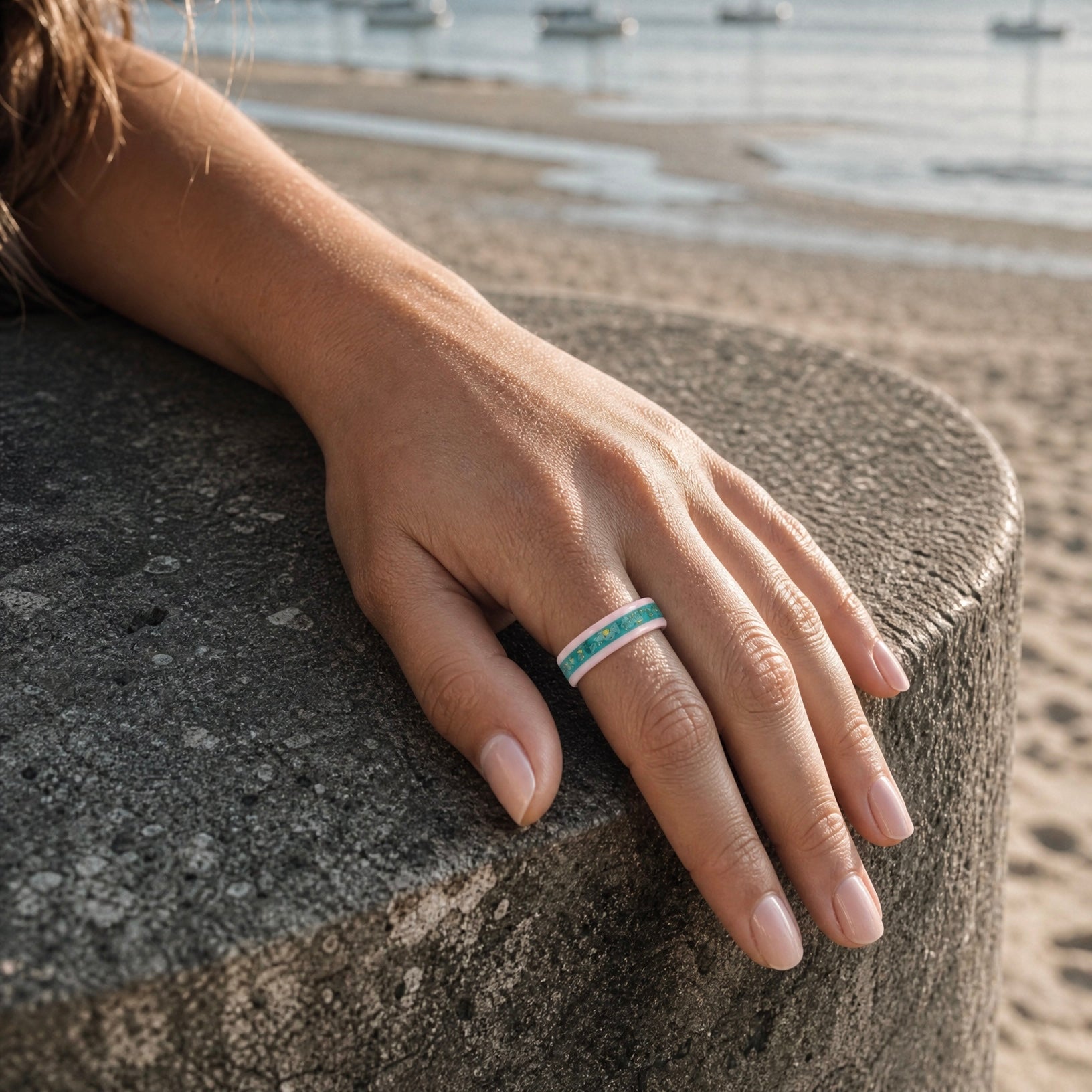 Pink ceramic ring with teal sea glass and gold leaf inlay, smooth polished band with ocean inspired design