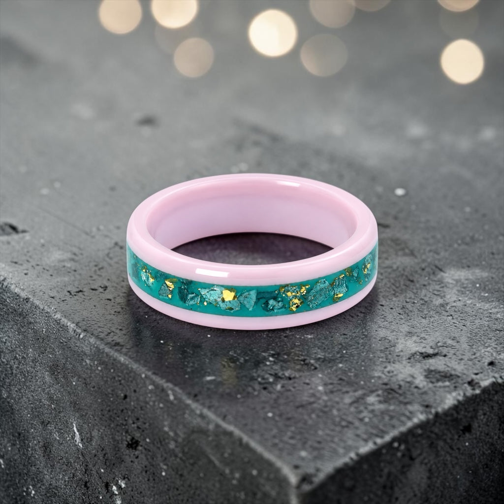 Pink ceramic ring with teal sea glass and gold leaf inlay, smooth polished band with ocean inspired design