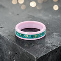 Pink ceramic ring with teal sea glass and gold leaf inlay, smooth polished band with ocean inspired design