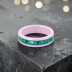 Pink ceramic ring with teal sea glass and gold leaf inlay, smooth polished band with ocean inspired design