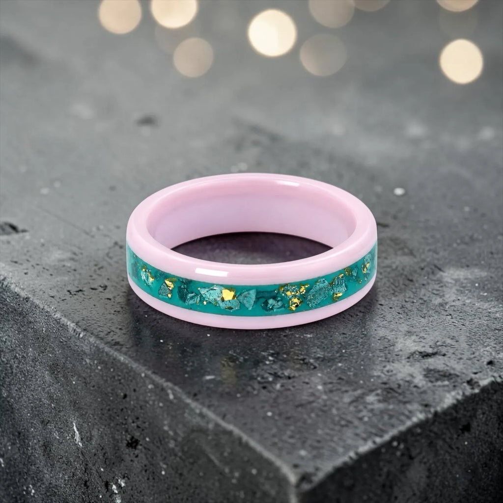 Pink ceramic ring with teal sea glass and gold leaf inlay, smooth polished band with ocean inspired design