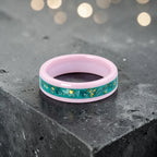 Pink ceramic ring with teal sea glass and gold leaf inlay, smooth polished band with ocean inspired design