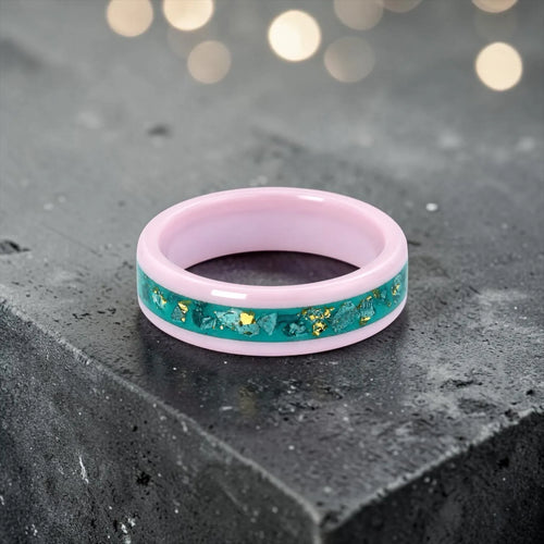 Pink ceramic ring with teal sea glass and gold leaf inlay, smooth polished band with ocean inspired design