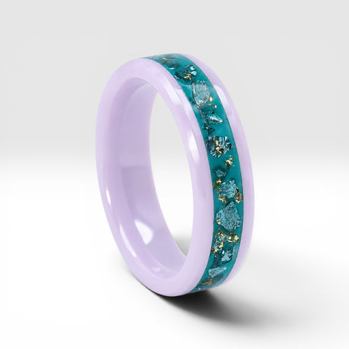 Pink ceramic ring with teal sea glass and gold leaf inlay, smooth polished band with ocean inspired design