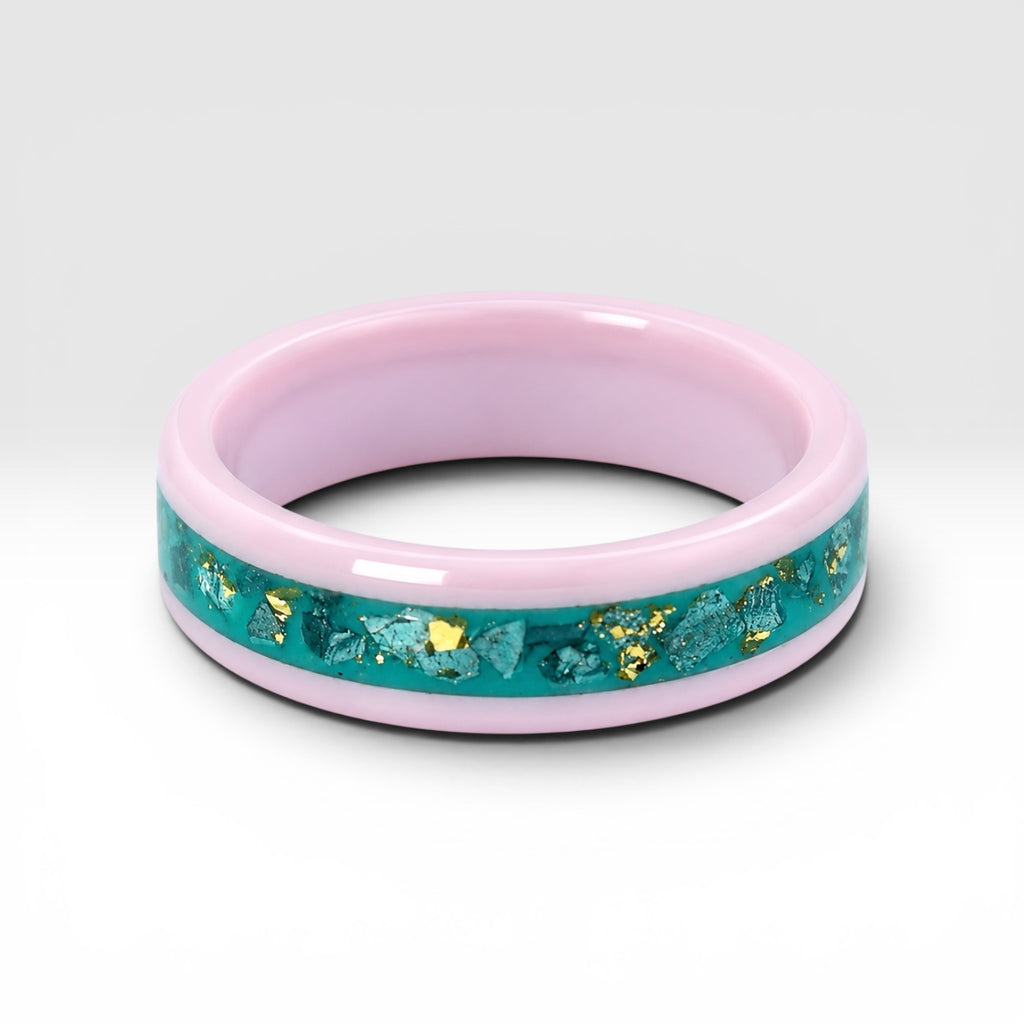 Pink ceramic ring with teal sea glass and gold leaf inlay, smooth polished band with ocean inspired design
