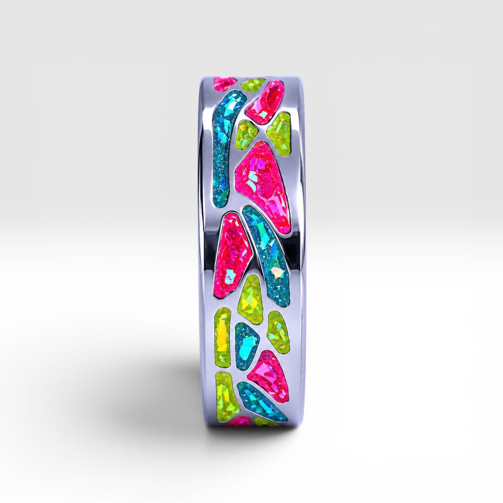 Arcadia titanium ring featuring a colorful abstract inlay with multi-color glow-in-the-dark elements inspired by retro arcade aesthetics.