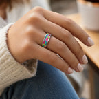 Arcadia titanium ring featuring a colorful abstract inlay with multi-color glow-in-the-dark elements inspired by retro arcade aesthetics.