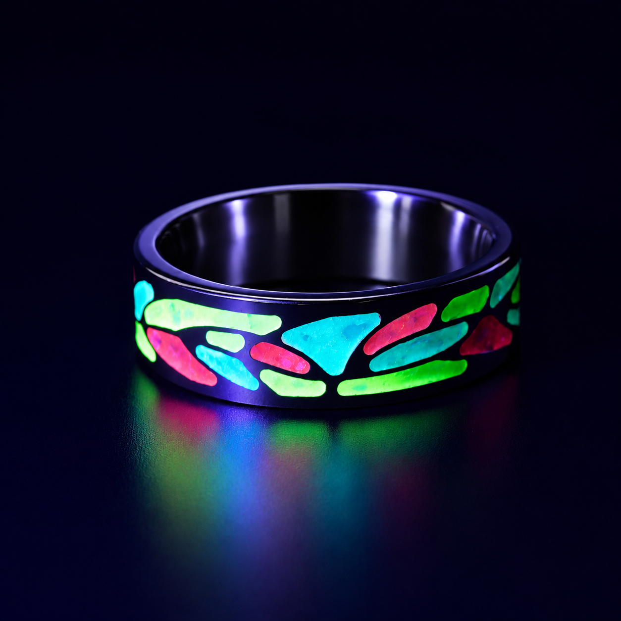 Arcadia titanium ring featuring a colorful abstract inlay with multi-color glow-in-the-dark elements inspired by retro arcade aesthetics.