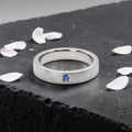 Sterling silver ring with flush set blue topaz and meteorite texture, minimalist handcrafted wedding 