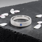 Sterling silver ring with flush set blue topaz and meteorite texture, minimalist handcrafted wedding 