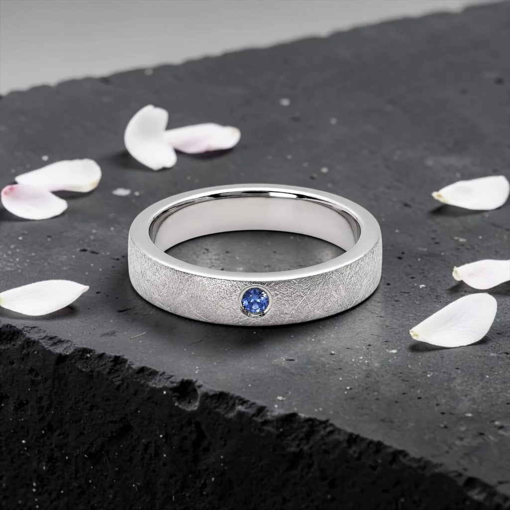 Sterling silver ring with flush set blue topaz and meteorite texture, minimalist handcrafted wedding 