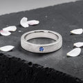 Sterling silver ring with flush set blue topaz and meteorite texture, minimalist handcrafted wedding 
