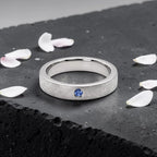 Sterling silver ring with flush set blue topaz and meteorite texture, minimalist handcrafted wedding 