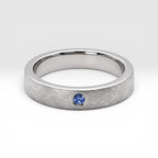 Sterling silver ring with flush set blue topaz and meteorite texture, minimalist handcrafted wedding 