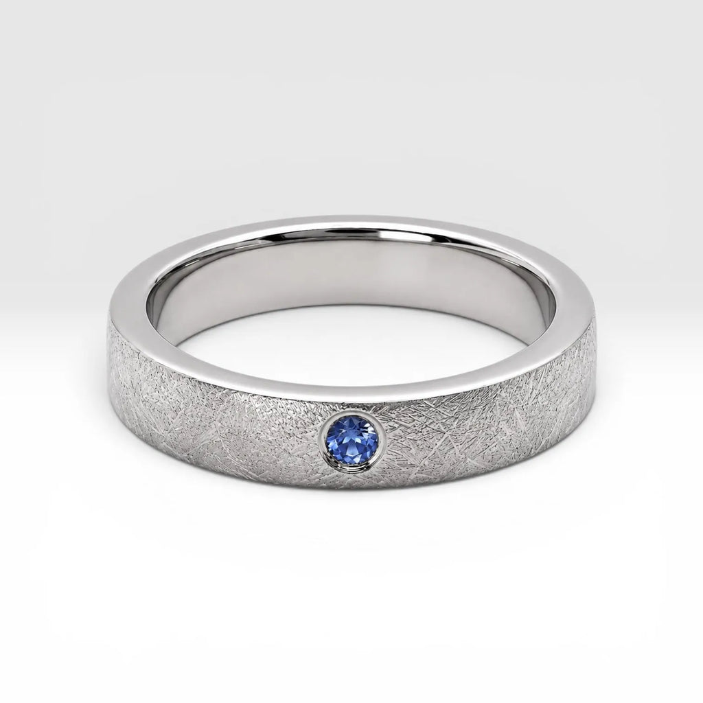 Sterling silver ring with flush set blue topaz and meteorite texture, minimalist handcrafted wedding 