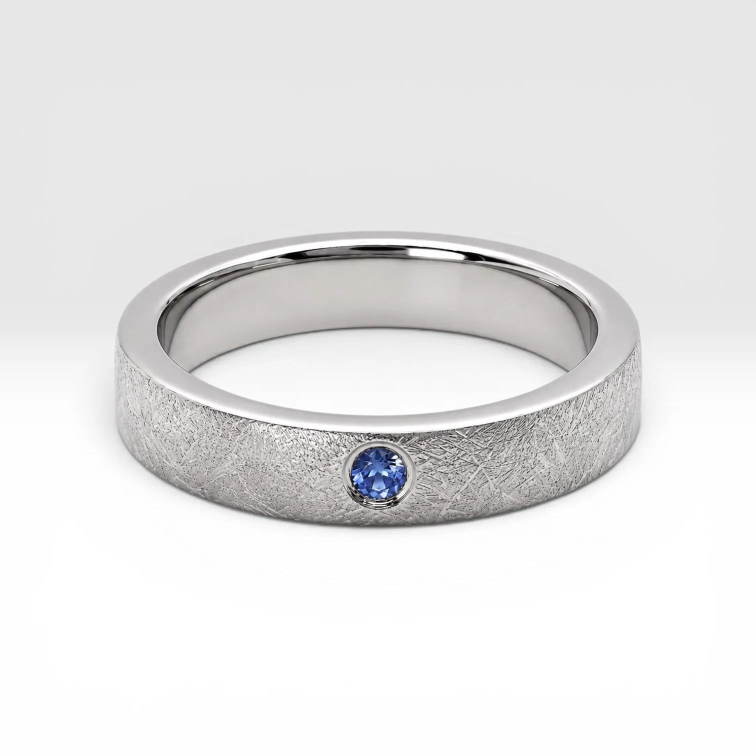 Sterling silver ring with flush set blue topaz and meteorite texture, minimalist handcrafted wedding 
