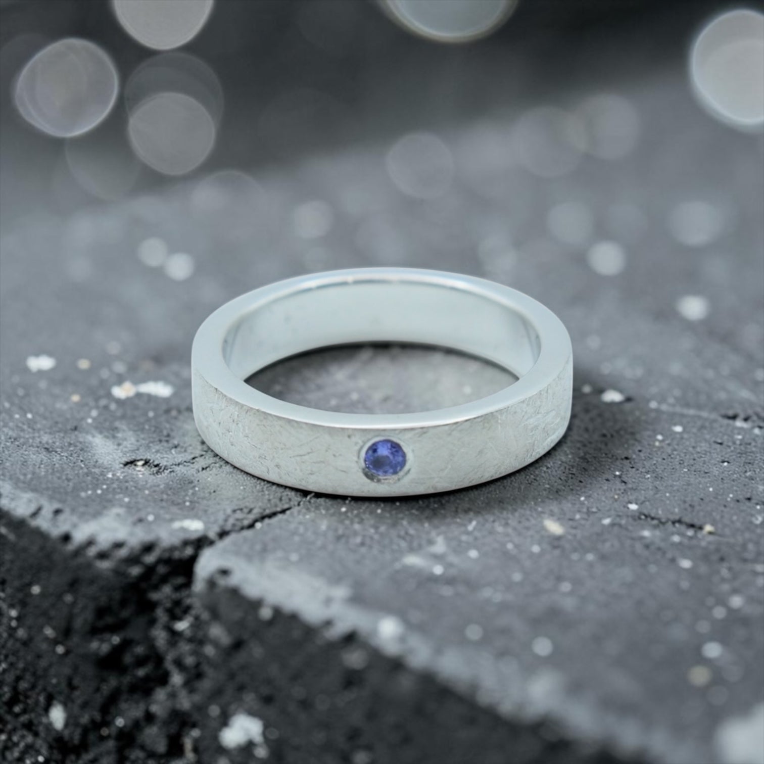 Sterling silver ring with flush set blue topaz and meteorite texture, minimalist handcrafted wedding 