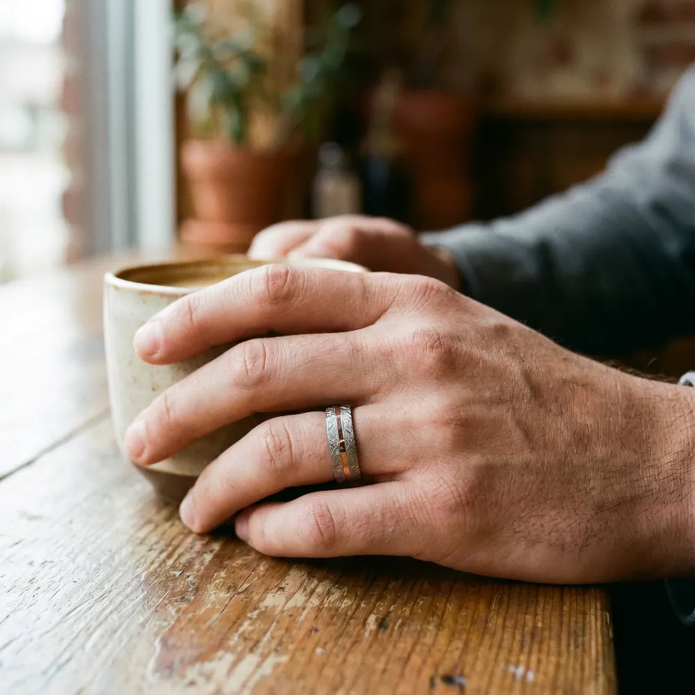 Sterling silver ring with rose gold offset inlay and meteorite texture, minimalist handcrafted wedding band
