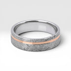 Sterling silver ring with rose gold offset inlay and meteorite texture, minimalist handcrafted wedding band