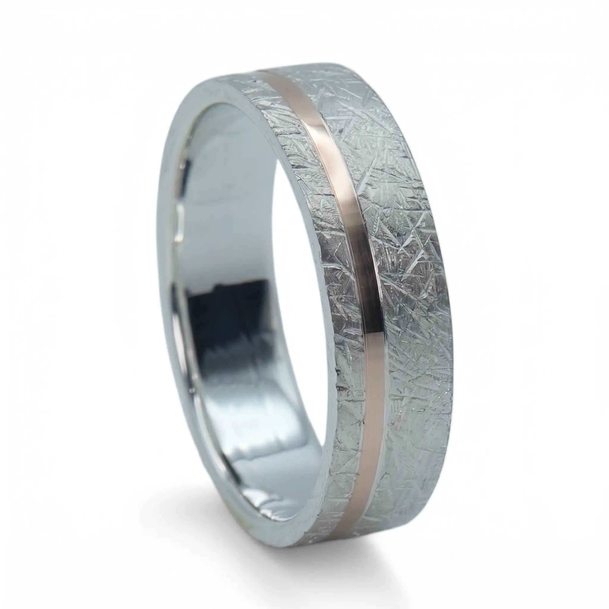 Sterling silver ring with rose gold offset inlay and meteorite texture, minimalist handcrafted wedding band