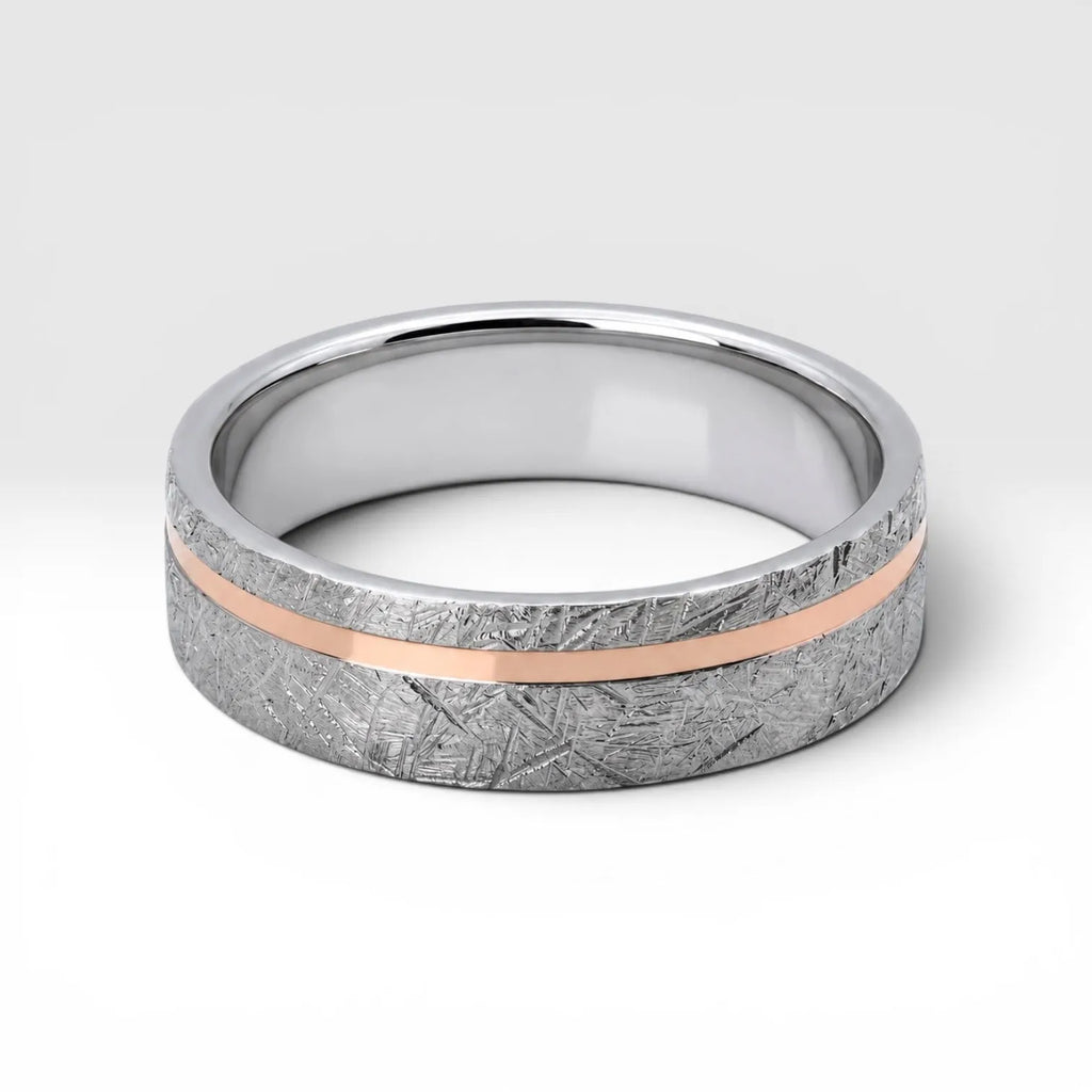 Sterling silver ring with rose gold offset inlay and meteorite texture, minimalist handcrafted wedding band