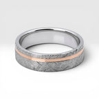 Sterling silver ring with rose gold offset inlay and meteorite texture, minimalist handcrafted wedding band