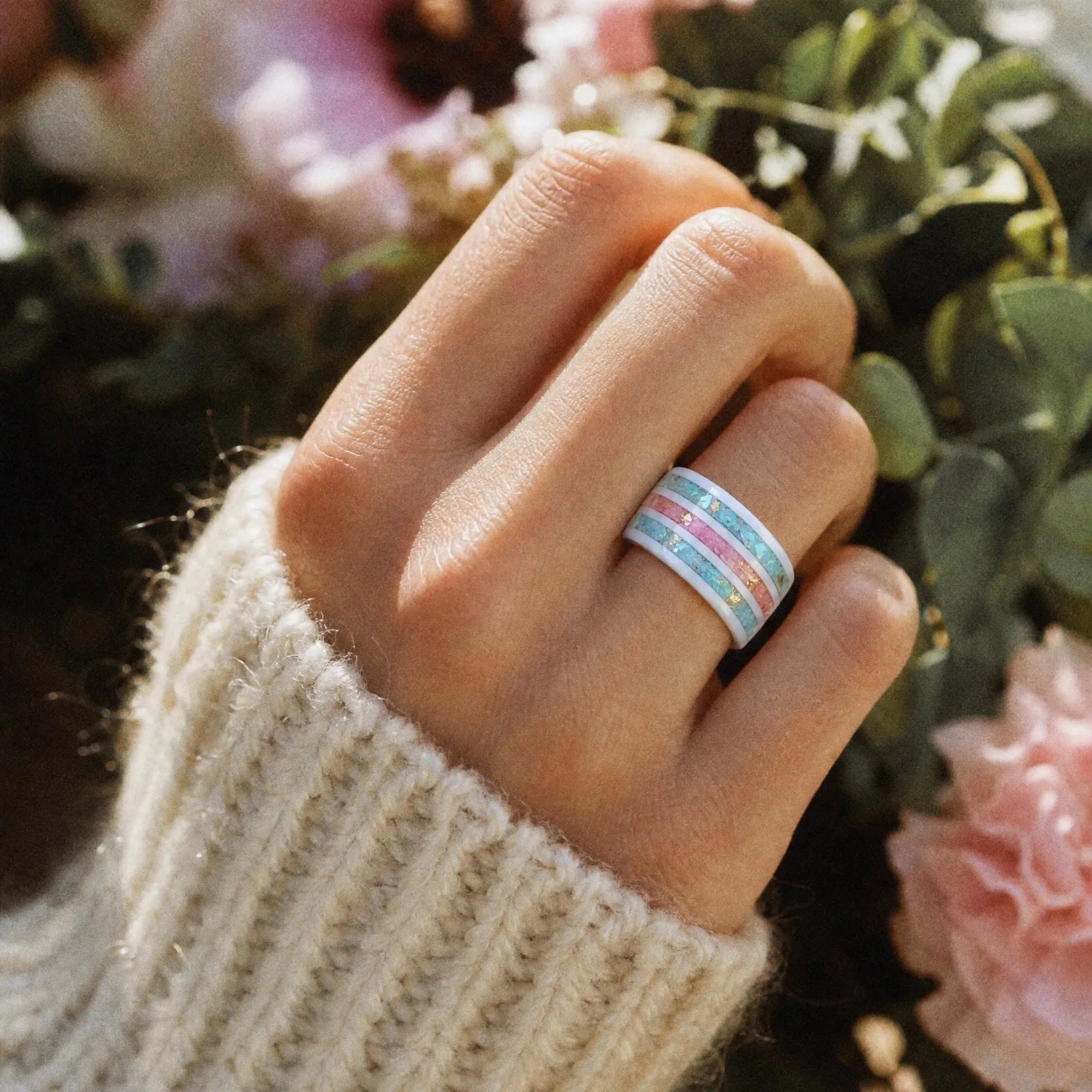 Bloomstripe white ceramic ring featuring three floral inlay channels with real flower petals, iridescent accents, and gold leaf details.