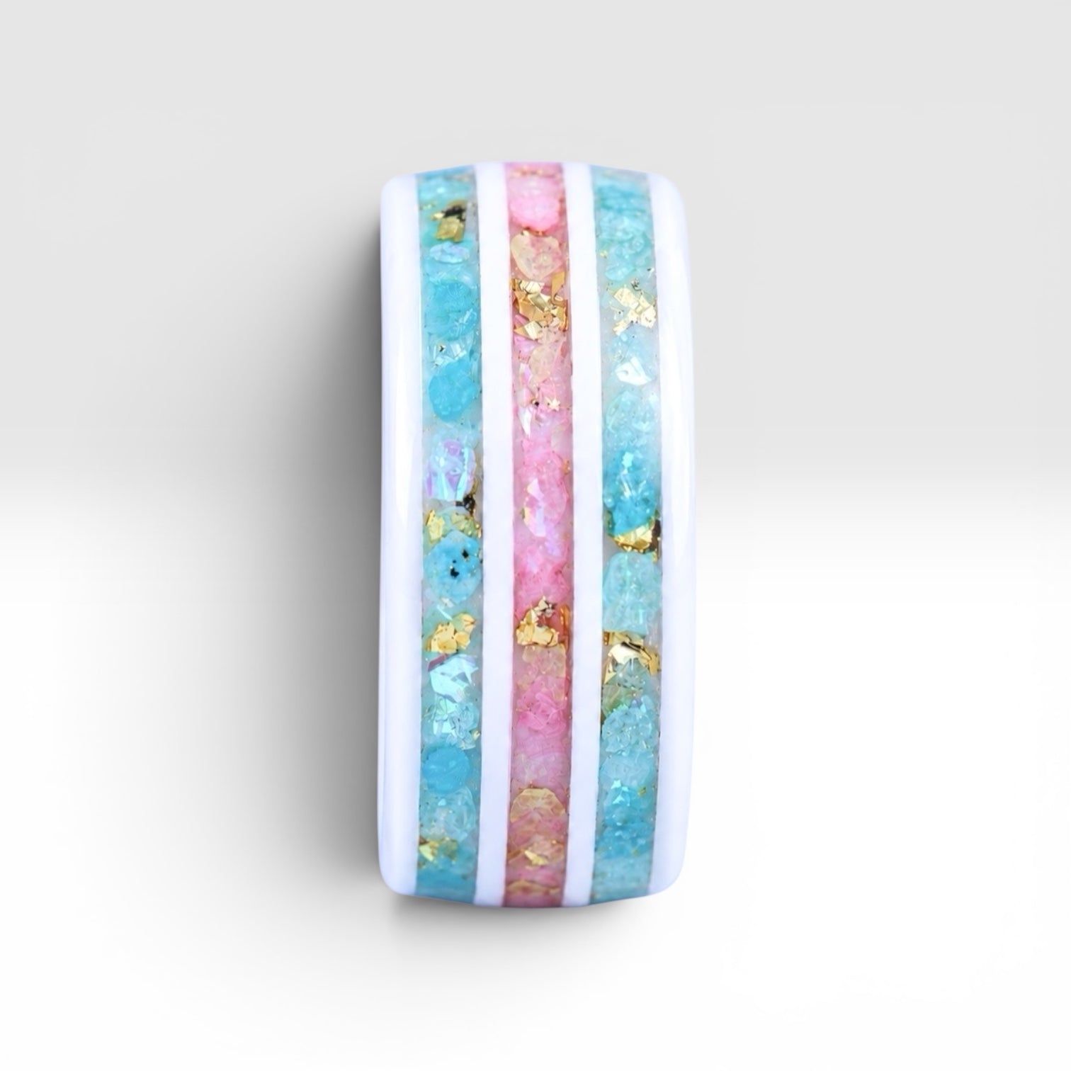 Bloomstripe white ceramic ring featuring three floral inlay channels with real flower petals, iridescent accents, and gold leaf details.