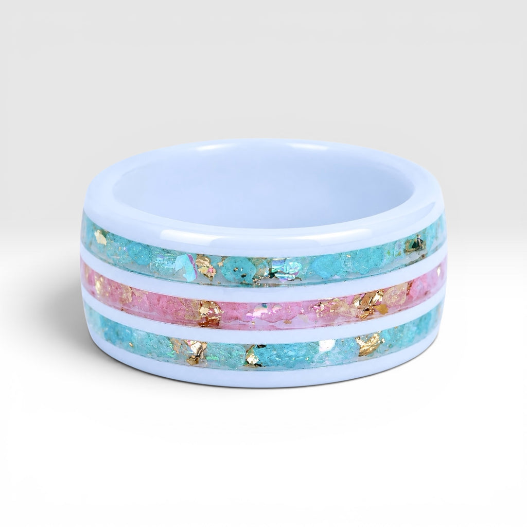 Bloomstripe white ceramic ring featuring three floral inlay channels with real flower petals, iridescent accents, and gold leaf details.