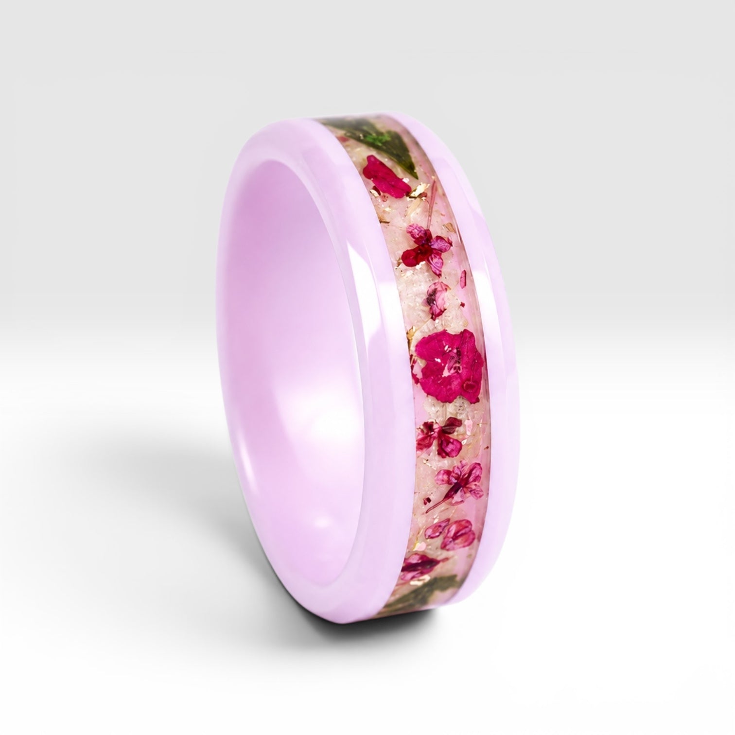 Blosselle pink ceramic ring featuring real pressed flowers preserved in a handcrafted floral inlay.