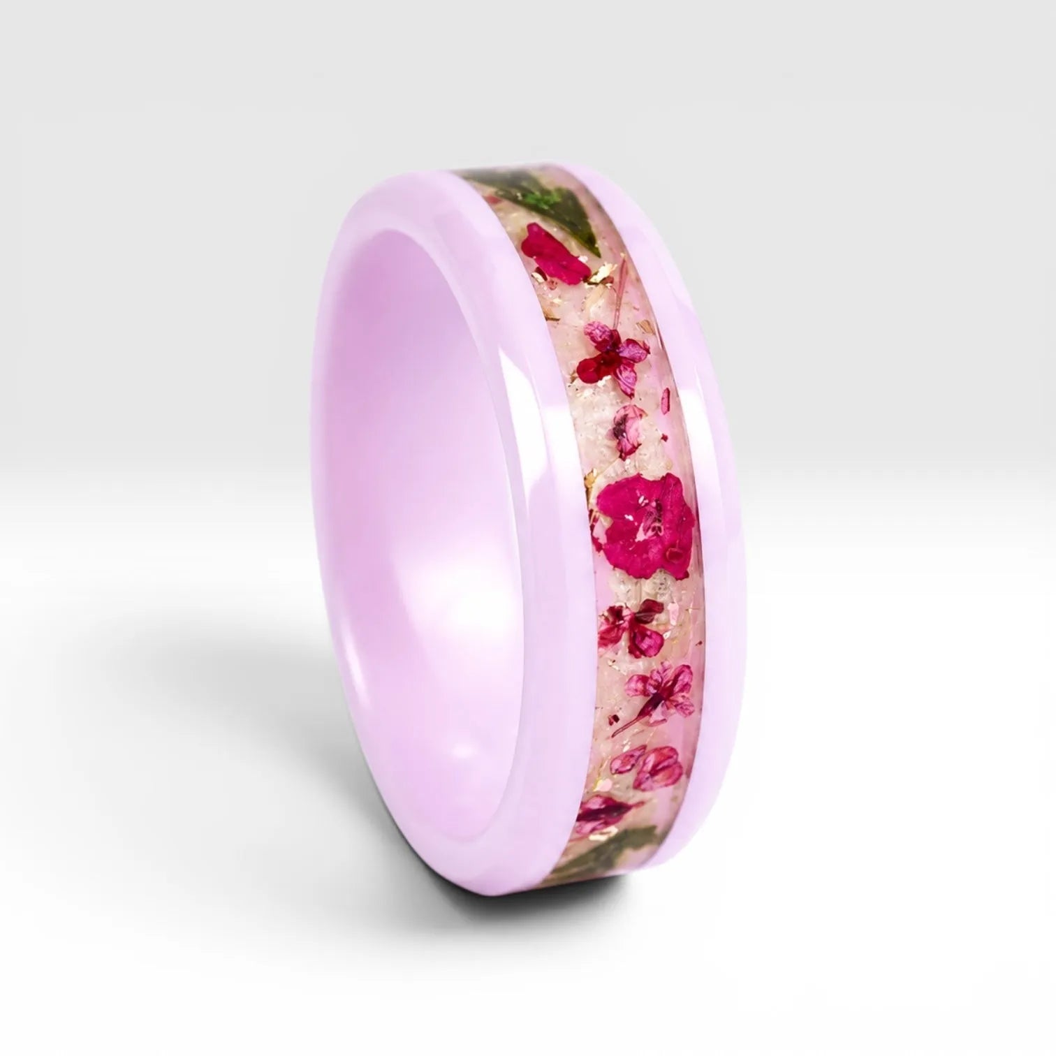 Blosselle pink ceramic ring featuring real pressed flowers preserved in a handcrafted floral inlay.