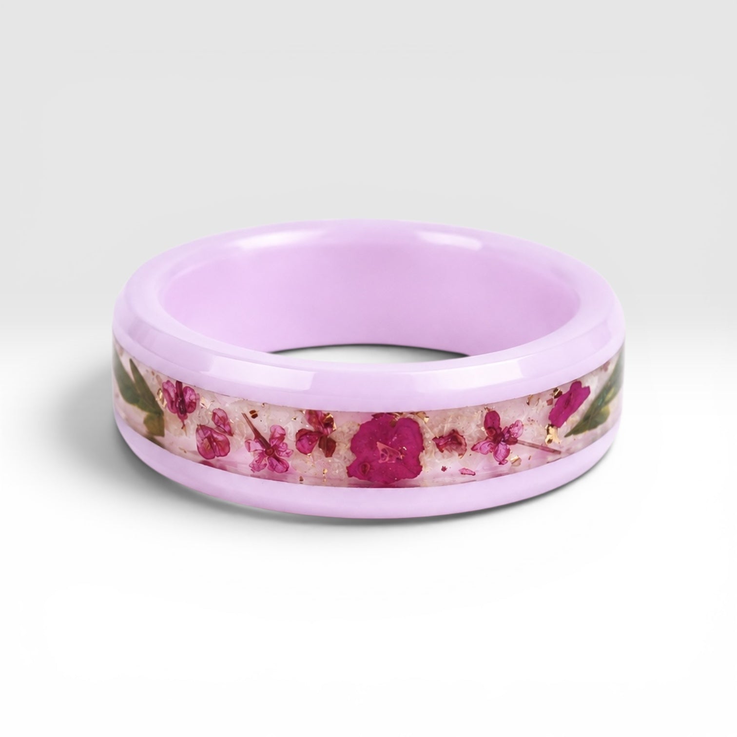 Blosselle pink ceramic ring featuring real pressed flowers preserved in a handcrafted floral inlay.