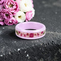 Blosselle pink ceramic ring featuring real pressed flowers preserved in a handcrafted floral inlay.
