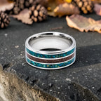 Tungsten ring with chrysocolla and cinnabar inlay featuring bold blue and red tones, polished band with textured design