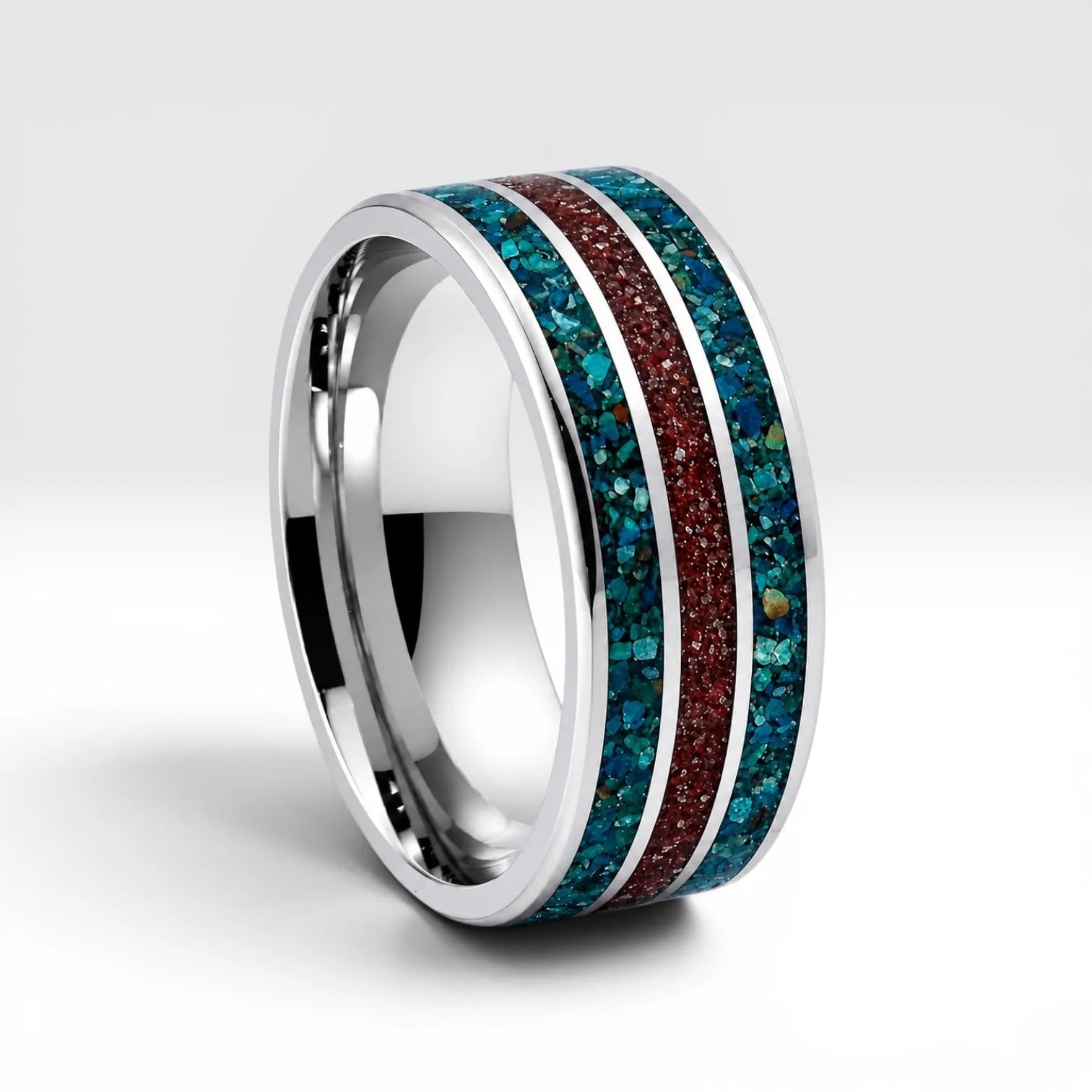 Tungsten ring with chrysocolla and cinnabar inlay featuring bold blue and red tones, polished band with textured design