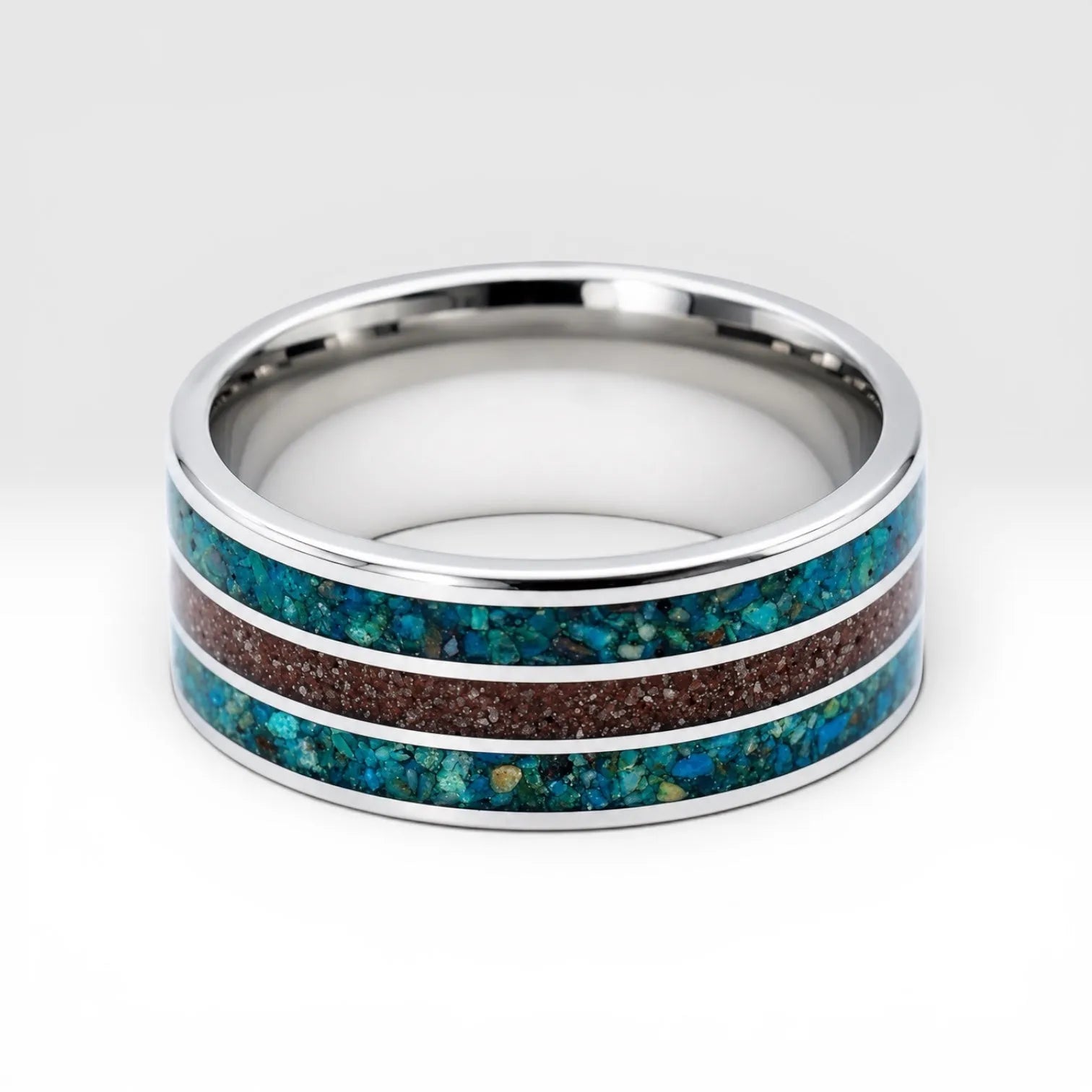 Tungsten ring with chrysocolla and cinnabar inlay featuring bold blue and red tones, polished band with textured design