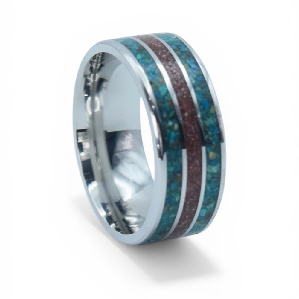 Close-up of tungsten ring with crushed chrysocolla and cinnabar showing vibrant blue and red contrast