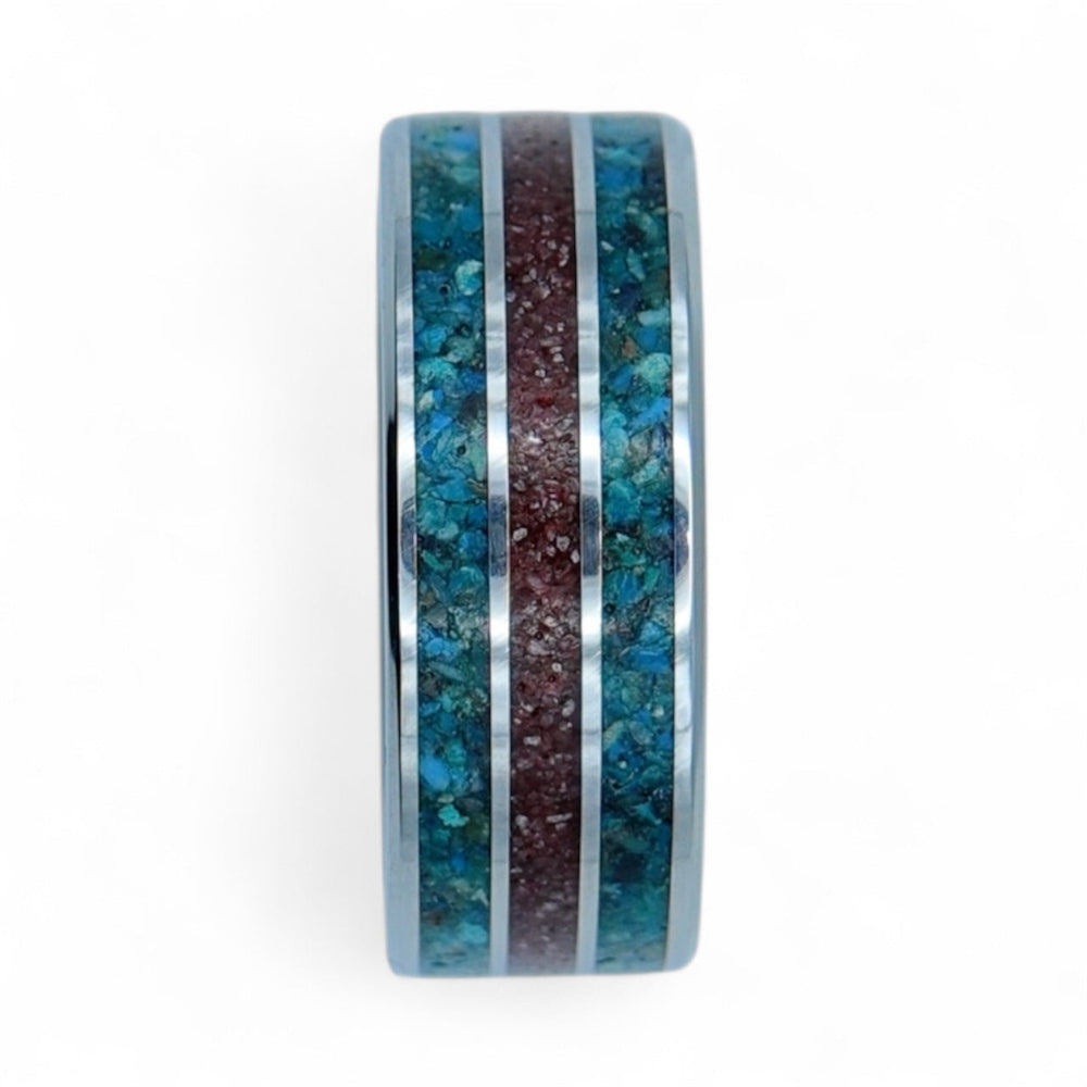 Polished tungsten band with chrysocolla and cinnabar inlay creating a bold natural color combination