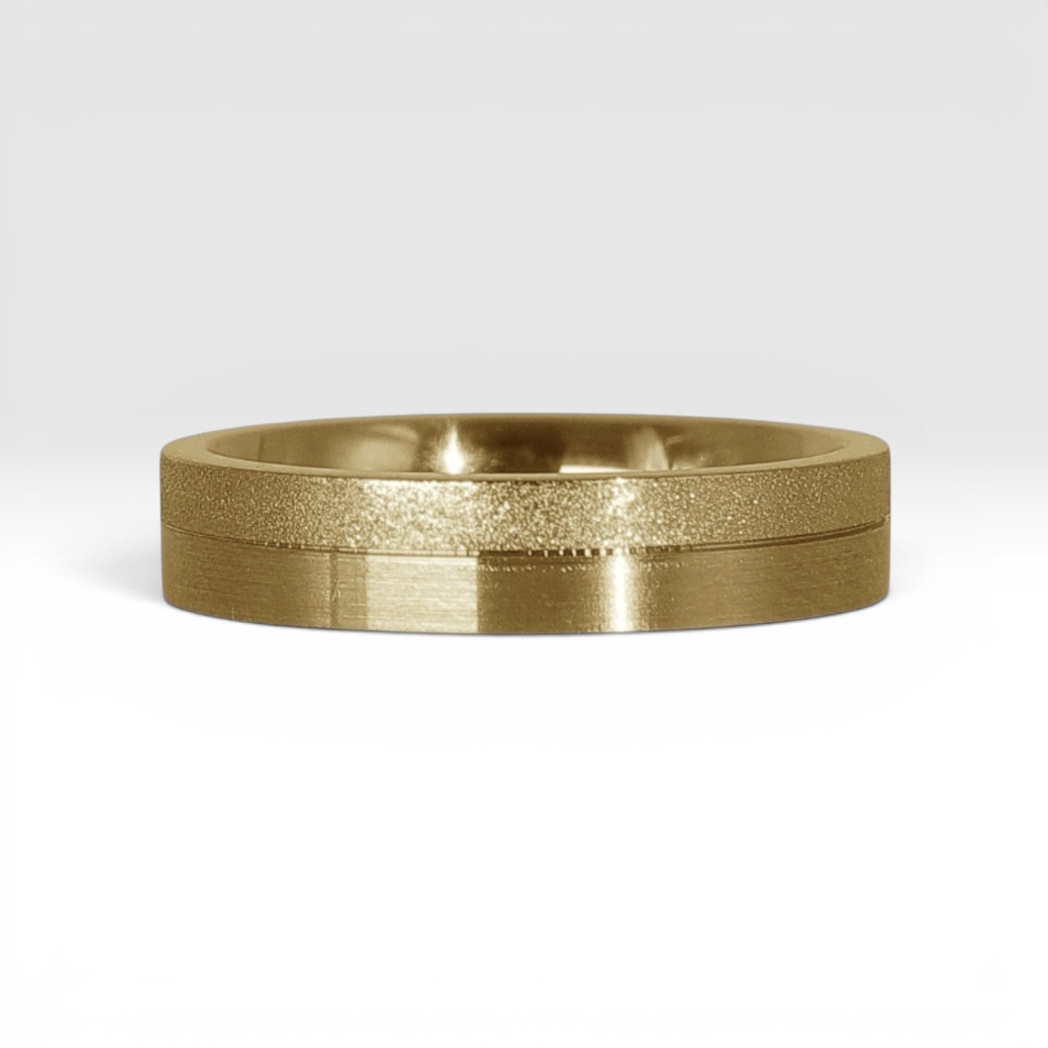 4mm gold women's wedding band featuring two-tone frosted finish and satin finish with architectural groove detail