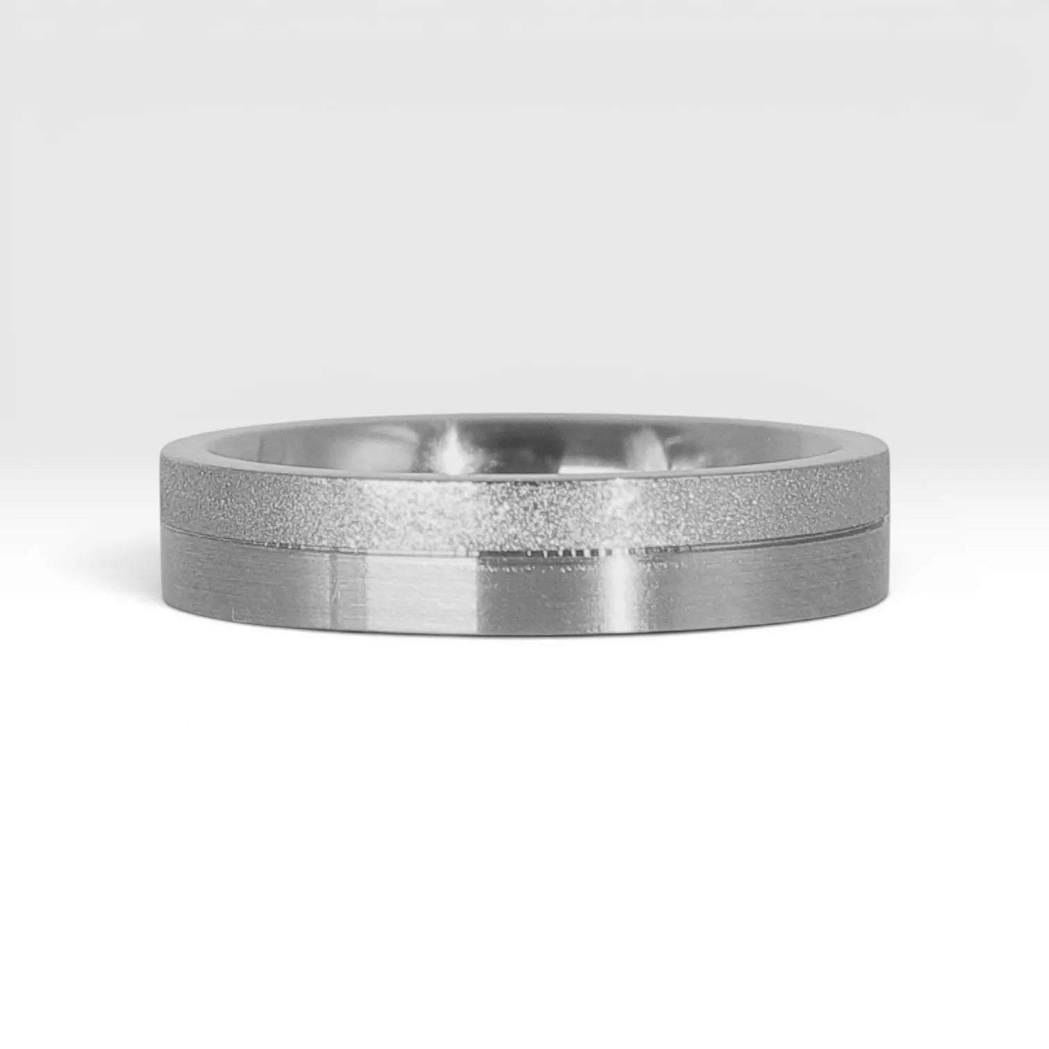 4mm sterling silver women's wedding band featuring two-tone frosted finish and satin finish with architectural groove detail