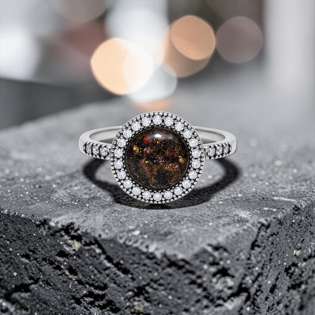 Resin gemstone ring with goldstone sparkle and lava opal shimmer set in sterling silver halo band