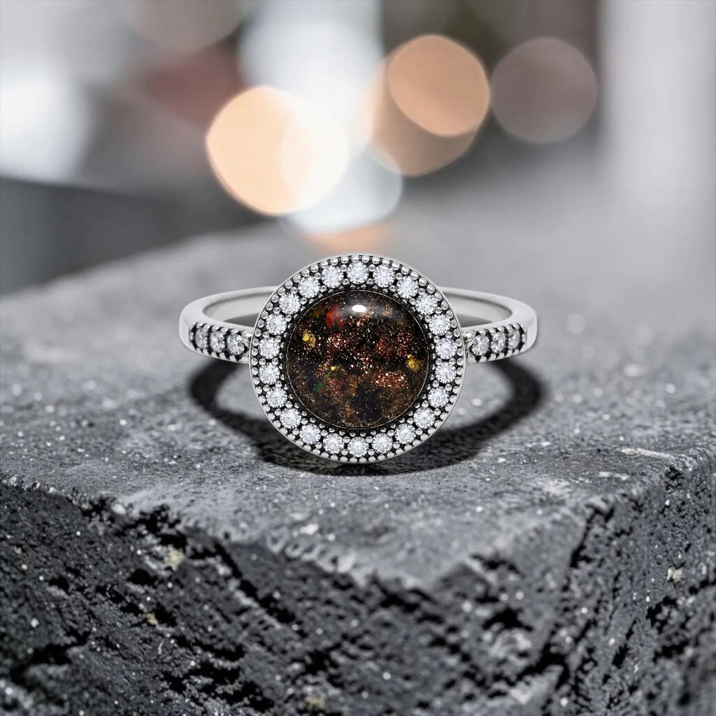 Resin gemstone ring with goldstone sparkle and lava opal shimmer set in sterling silver halo band